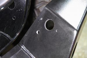 Holes were drilled in the bumper for the lighting socket and the supplemental braking system’s air hose connection.