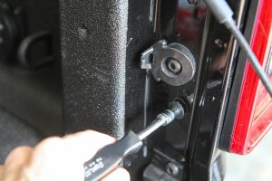 Screws that secure the taillights are removed.