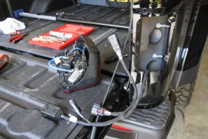 Nylon cable ties secure the wiring harness in place.