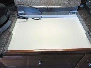 A shallow box was built to replace the electric drop-in unit and the base that supported it.