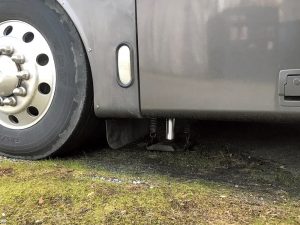Usually, an RV should be leveled as soon as it’s situated on a suitable pad. An RV may be equipped with stabilizer jacks, but they should not be used to lift the RV. Rather, leveling is achieved with leveling jacks (shown here) or blocks.