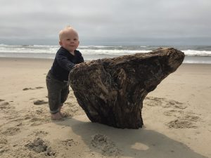 Tucker, the author’s son, shows off his newly acquired standing skills at South Jetty Beach near Florence.
