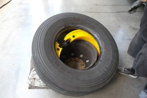 Once the Rettroband is inserted into a tire, the tire and Rettroband assembly are mounted to the wheel rim, a task made easier by using tire lubricant.