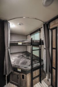 Rear double-queen bunks in the North Trail 31BHDD provide comfortable sleeping quarters.