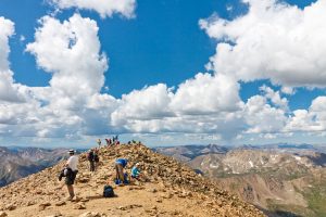 Hikers enjoy the view, and their accomplishment, on the summit of 14,433-foot Mount Elbert, the highest peak in Colorado.