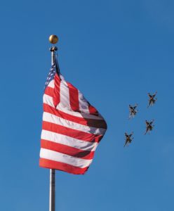 While attending an air show at Davis-Monthan Air Force Base in Arizona, Harry Hanbury witnessed the Thunderbirds, the U.S. Air Force Air Demonstration Squadron, flying in formation and, from his vantage point, appearing to salute the American flag.