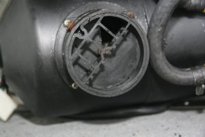 The burner’s air inlet can be adjusted to achieve the proper ratio of air to fuel.