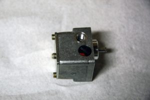 The fuel pump is mounted to the front of the diesel burner; pump pressure can be adjusted by turning the screw very slightly on the side of the pump.