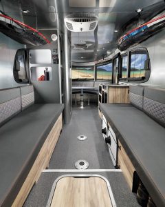 A versatile rear lounge area that can be used for seating, sleeping, or storing outdoor gear is one hallmark of the Airstream Basecamp.