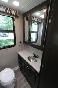 The Greyhawk 29MV's bath includes a vanity with a stainless-steel sink.