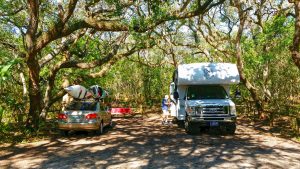 The Amelia River Campground at Fort Clinch State Park offers shaded RV sites.