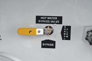 The hot-water bypass valve allows antifreeze to avoid the tank and go directly through the hot-water lines.