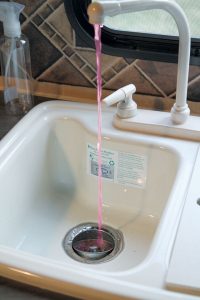 Pump antifreeze through each faucet, one at a time, starting with the fixture farthest from the water pump. Pump the liquid until a solid stream appears.