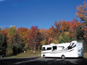 The changing colors of autumn in Michigan’s Upper Peninsula create a striking backdrop for Joe Sullivan’s Coachmen motorhome. 
