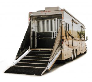 A sturdy rear ramp accommodates horses, small cars, etc.