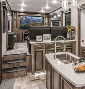 The living area in the G381REF floor plan is a dedicated space accessible from the galley.
