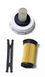 A Magnevator accessory (top) activates DEF pumps with a magnetic valve so portable DEF jugs can be refilled. The Cummins DEF filter includes a small tool for removing the filter from the housing.