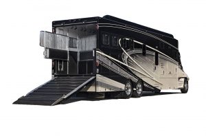 As shown in this four-horse Equine Motorcoach, spring-loaded gates in the rear separate horses for travel in the climate-controlled stall area.