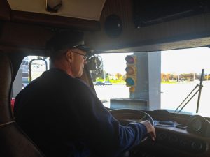 Ken behind the wheel.