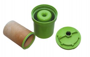 The prefilter ― shown here with the top off and the used filter removed ― is designed to trap silt, rust, sand, and sediment before it reaches the main filter.