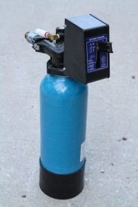 An iron filter removes iron and sulfur by oxidizing them and trapping tAn iron filter removes iron and sulfur by oxidizing them and trapping them in the filter media.hem in the filter media.