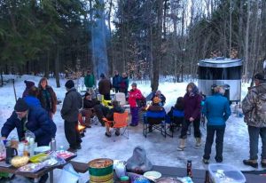 The Wendlands and their winter camping friends socialize as they do in other seasons, albeit with more clothing layers.