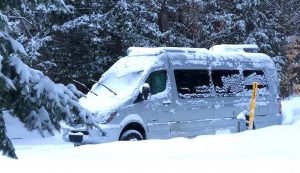 The Wendlands stay cozy inside their motorhome, here at Michigan's Tahquamenon Falls State Park, which keeps some sites cleared of snow.