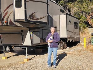 Private investigator Art Rivera, with his dog, Buddy, likes the flexibility of running his business from an RV.