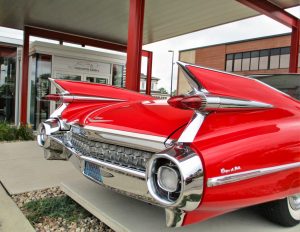 A classic Cadillac Coupe DeVille is parked at The Automobile Gallery.