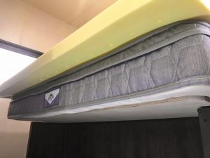 Some RVers with short queen mattresses extend the platform to accommodate a regular queen.