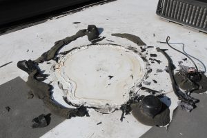 The old satellite dish was removed, an abundance of sealant removed, and the roof cleaned.