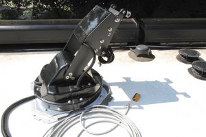 To facilitate access to the base of the unit, a battery was used to raise the elevation arm out of the way.