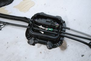 The kit included a raised connection box to protect the coaxial and communication cable connections.