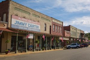 Signs on historic downtown buildings in Plains, Georgia, recognize the towns most famous resident, former President Jimmy Carter.