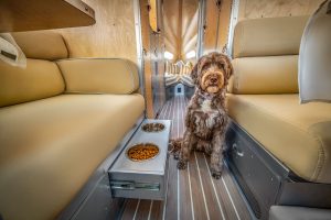 Inside, Pet-Flex features include a drawer for feeding bowls, remote temperature monitoring, and a coordinated dog bed.