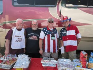 Pit masters (left to right) Mike Neighbours, Rodger Donnelly, Geoff Matthews, and Pat Giannini from FMCA’s RVQue chapter showed off their skills during a multichapter prerally before the Gillette convention.