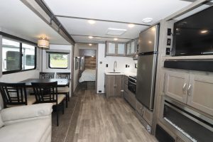 The test unit, with modern farmhouse decor, an L-shaped galley, an optional dining table, and a front bedroom.