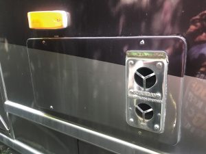 Some RVs have exterior panels to help with maintenance; some just have intake/exhaust ports.