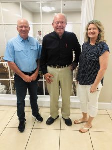 Tiffin Motorhomes Inc. CEO and founder Bob Tiffin (center) with Nathan and Kim Davidson of Davidson RV in Belmont, Mississippi. 