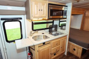 Galley conveniences include a counter extension and a cooktop cover.