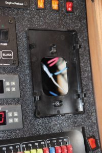 With the wiring connectors unplugged, the existing mounting screws were visible.