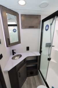 The master bath has a fiberglass shower with glass doors.