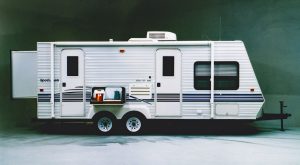 The company patented a rear-slide mechanism in 2001, shown here on a Sportsmen Ultralite travel trailer.