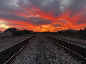 Dick Anderson captured this glowing sky from train tracks in Benson, Arizona, and noted, “I like to think this is my wife and me, equal, separate, yet in unison in our lives as we move toward the sunset.” 