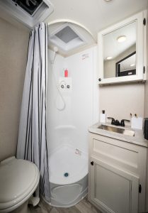 The 16FBS includes a corner shower in the rear bath; other floor plans have a tub-shower combination. 