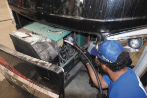 A 3-foot-long Proteng tube inserted into the Cummins Onan generator. 