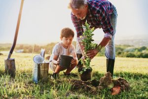Planting trees with youngsters is a great way to celebrate Arbor Day.