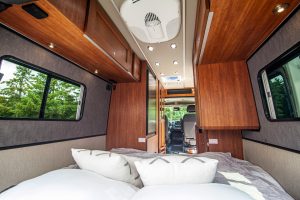 The rear lounge in the Roadtrek Play SRT motorhome converts to a queen-size bed or can be configured as twin beds if desired.