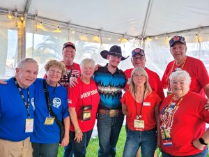 Left to right: Barry and Donna Wynott, Bo and Karen deBlieux, Cale Moon, Joe Padberg, Diane Pepperell, and Paul and Melody Thomas meet before Cale’s performance.