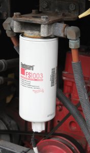 The primary fuel filter element may contain a water-in-fuel sensor, which must be disconnected before removal.